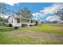 Side view of the manufactured home showcasing a covered awning at 4844 Creek Meadow Trl, Lakeland, FL 33810