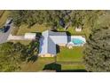 Aerial view of house, pool, and surrounding landscape at 1507 Hontoon Rd, Deland, FL 32720