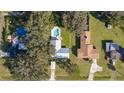 A landscape view shows a single-Gathering home with a pool at 1507 Hontoon Rd, Deland, FL 32720