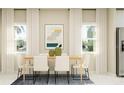 Bright dining room with a light wood table and white chairs at 7306 Ivy Tendril Ave, Orlando, FL 32829