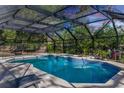 Relaxing screened pool and spa, perfect for outdoor enjoyment at 817 Helen Ave, Deland, FL 32720