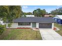 Charming single-story home with newly painted exterior and landscaping at 156 Whitman Rd, Winter Haven, FL 33884