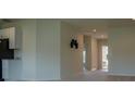 Bright hallway with neutral walls and carpeted floors at 2871 Parkfield Rd, St Cloud, FL 34772