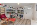 Bright entryway with shoe storage and comfy chair at 100 Cordova Rd, Auburndale, FL 33823