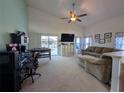 Spacious Gathering room with pool view and plenty of natural light at 108 Emeraldview Ave, Davenport, FL 33897