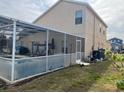 Screened patio area overlooking a refreshing pool at 108 Emeraldview Ave, Davenport, FL 33897