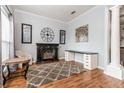 Living room with fireplace, hardwood floors, and built-in shelving at 1046 Island Pointe Dr, Winter Garden, FL 34787