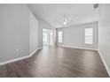 Spacious living room with light gray walls and wood-look flooring at 2003 Rocky Pointe Dr, Lakeland, FL 33813