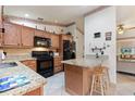 Kitchen features granite countertops and ample cabinetry at 4680 Poinciana Dr, Indian Lake Estates, FL 33855