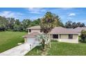 Two-story house with a large backyard and palm trees at 10420 Vista Del Sol Cir, Clermont, FL 34711