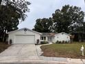 Newly renovated home with a modern exterior and solar panels at 605 Aldama Ct, Ocoee, FL 34761