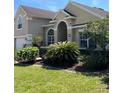 Attractive single-Gathering home with a lush front lawn and well-maintained landscaping at 113 Walton Heath Dr, Orlando, FL 32828