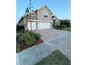 Charming single-Gathering home with a spacious three-car garage and meticulously paved driveway at 113 Walton Heath Dr, Orlando, FL 32828
