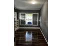 Living room with built-in shelving and large windows at 1112 W 12Th St, Lakeland, FL 33805