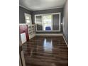 Living room with built-in shelving and a brick fireplace at 1112 W 12Th St, Lakeland, FL 33805