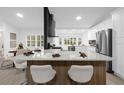 Modern kitchen with large island, perfect for entertaining, and breakfast bar at 27100 Racquet Cir, Leesburg, FL 34748