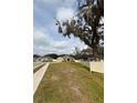 House with a large oak tree in the front yard at 2793 Hudson St, Lakeland, FL 33810