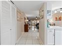 Bright hallway with tile flooring, leading to the living area and kitchen at 3004 Granada Ct # 3004, Lake Wales, FL 33898