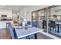 Elegant dining area with a farmhouse table and statement mirrors at 251 Puma Loop, Groveland, FL 34736