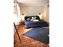 Main bedroom with a king-size bed and a dandelion wall decal at 311 N Baker St, Mount Dora, FL 32757