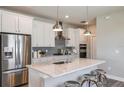 Modern kitchen with white cabinets, granite countertops, and stainless steel appliances at 5903 Sw 87Th Ave, Ocala, FL 34481