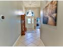 Elegant entryway with tile flooring and large artwork at 706 Lake Diamond Ave, Ocala, FL 34472