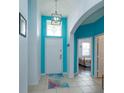 Bright teal entryway with tile flooring and view of bedroom at 2254 Wyndham Palms Way, Kissimmee, FL 34747