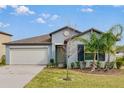 Charming single-story home featuring a well-manicured lawn and a two-car garage at 2133 Old Mining Rd, Lakeland, FL 33801