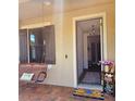 Front entryway with view into the home and a hanging porch swing at 4035 Solamor St, Lakeland, FL 33810