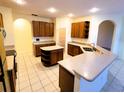 Spacious kitchen featuring an island and ample cabinetry at 2912 Sweetspire Cir, Kissimmee, FL 34746
