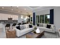 Open-concept living room featuring stylish decor and plenty of natural light at 5222 Sw 88Th Cir, Ocala, FL 34481