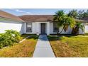 Front entrance of a home with walkway and landscaping at 3088 Sire Trl, Lakeland, FL 33811