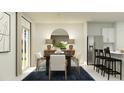 Bright dining area with table, chairs, and access to kitchen at 923 Hour Glass Rd, Lakeland, FL 33801