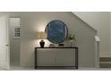Inviting entryway with console table, mirror, and staircase at 923 Hour Glass Rd, Lakeland, FL 33801