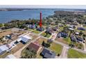 Property view showcasing the home's location near a lake at 164 Sunrise Hill Ln, Auburndale, FL 33823