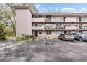 Exterior view of a condo building showcasing its architecture and parking at 150 El Dorado # 101, Winter Haven, FL 33884