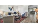 Open living space featuring a sofa and a view into the dining area at 2227 Miguel St, Lakeland, FL 33801