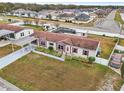 Aerial view of manufactured home with spacious yard and pool at 555 Lindsey Dr, Lakeland, FL 33809
