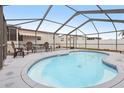 Screened-in pool area with ample seating and space for entertaining in the backyard at 555 Lindsey Dr, Lakeland, FL 33809