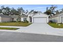 One story home with attached garage and neat landscaping at 1976 Thompson Preserve Blvd, Bartow, FL 33830