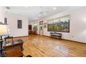 Bright living room featuring hardwood floors and ample natural light at 3060 Granada Dr, Indian Lake Estates, FL 33855