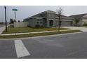 Inviting single-Gathering home featuring a manicured lawn and a side yard fence at 400 Watusi Way, St Cloud, FL 34772