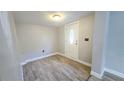 Light and bright entryway with wood-look tile floor at 1650 Pine Ave, Mount Dora, FL 32757