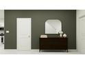 Entryway with a dark wood dresser and an arched mirror at 922 Hour Glass Rd, Lakeland, FL 33801