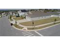Corner lot featuring a well-manicured lawn and a two-car garage at 930 Fieldstone Way, Haines City, FL 33844