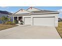 Charming single-story home featuring a well-manicured lawn and a two-car garage at 930 Fieldstone Way, Haines City, FL 33844