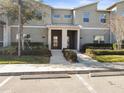 Charming townhome exterior with well-maintained landscaping and parking at 760 Pebble Beach Dr, Davenport, FL 33896