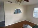 Bright living room with wood flooring and built-in shelving at 1106 Avenue N, Haines City, FL 33844