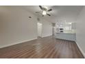 Open living room features hardwood floors and an open concept kitchen at 854 4Th St, Winter Haven, FL 33881