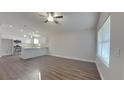 Open concept living room with hardwood floors and kitchen at 854 4Th St, Winter Haven, FL 33881